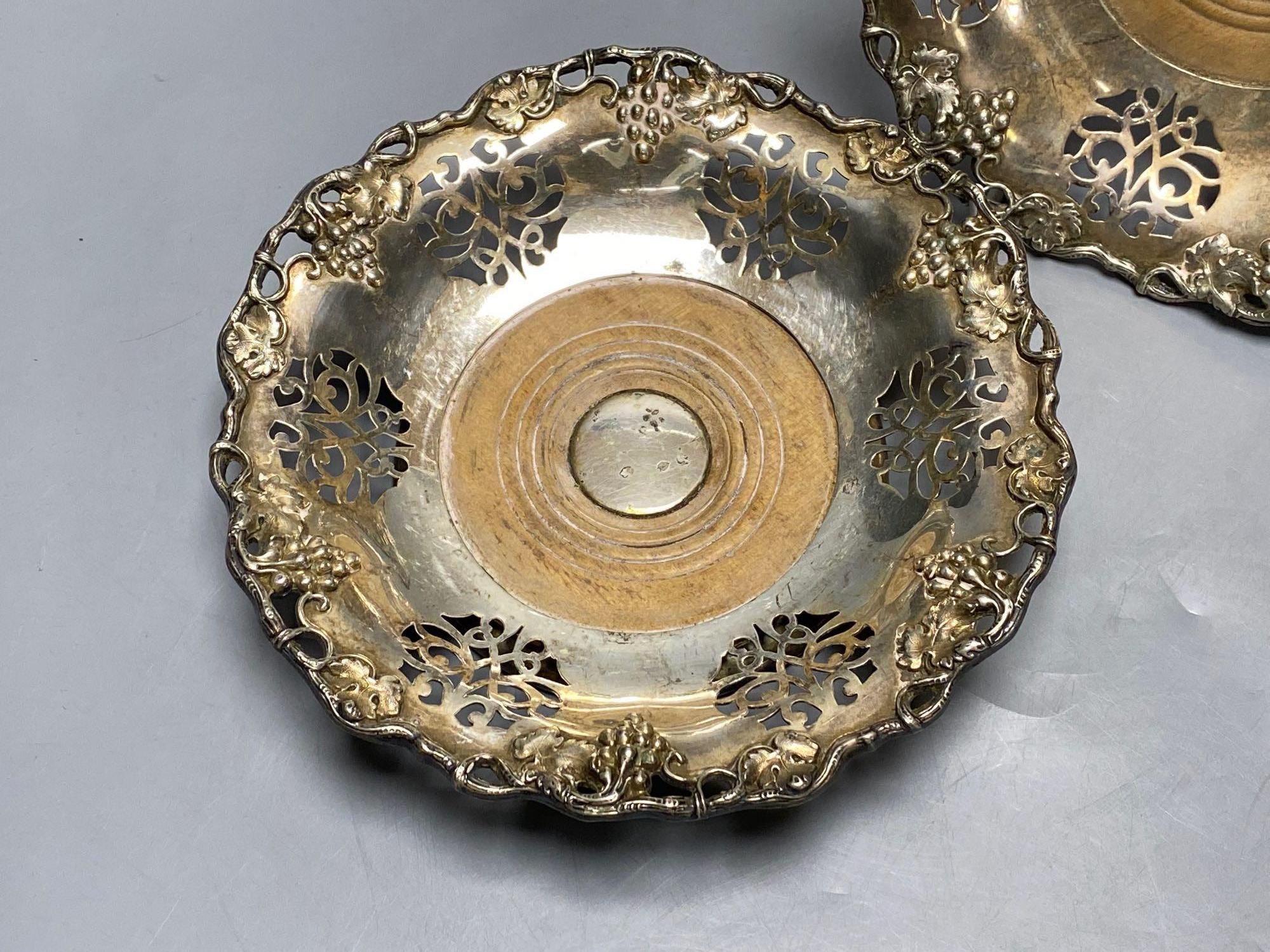 A pair of Victorian silver plated wine coasters, 20cm